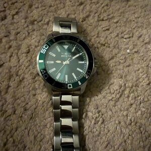 Invicta Silver Watch with Green Dial and Bezel Accents
